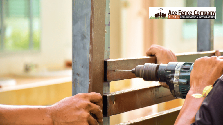 contractor repairing a metal fence